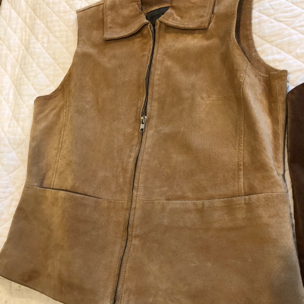 Two leather vests one fitted and lined